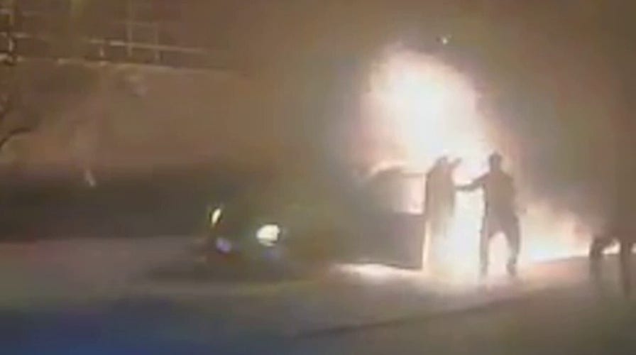 Wisconsin police rescue driver after minivan erupts in flames