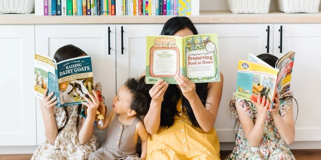An Oregon homeschool family holding books