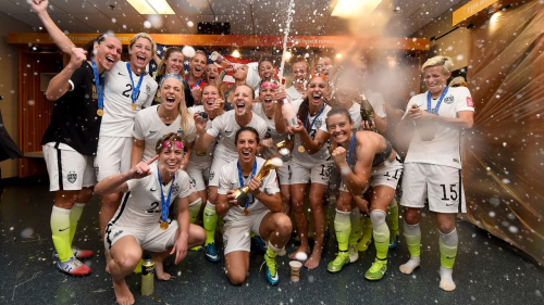 VANCOUVER, BC - JULY 05:  Carli Lloyd of USA celebrates with the trophy and her team mates in the locker room after winning the FIFA Women's World Cup 2015 Final between USA and Japan at BC Place Stadium on July 5, 2015 in Vancouver, Canada.  (Photo by Lars Baron - FIFA/FIFA via Getty Images)