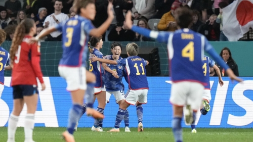 Japan's Hikaru Naomoto, centre, celebrates with teammates after scoring her team's first goal during the Women's World Cup Group C soccer match between Japan and Costa Rica in Dunedin, New Zealand, Wednesday, July 26, 2023. (AP Photo/Alessandra Tarantino)