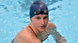 Penn transgender swimmer Lia Thomas speaks to her coach after winning the 500 meter freestyle during an NCAA college swimming meet with Harvard Saturday, Jan. 22, 2022, at at Harvard University in Cambridge, Mass. The University of Pennsylvania says it will work with the NCAA under its newly adopted standards for transgender athletes. Swimmer Lia Thomas competed on the men's team at Penn before transitioning.