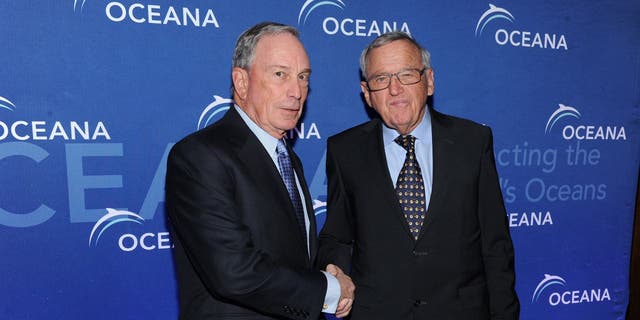 Hansjörg Wyss, right, shaking hands with Michael Bloomberg