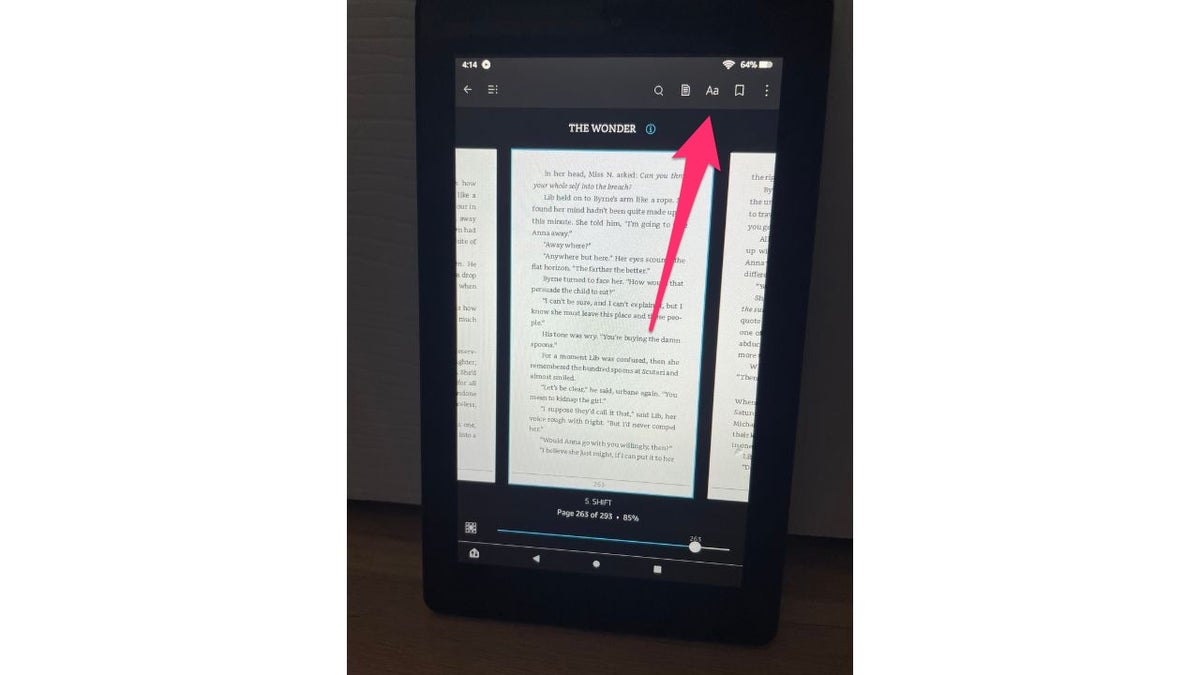 Red arrow pointing to the Aa icon on an Amazon Kindle