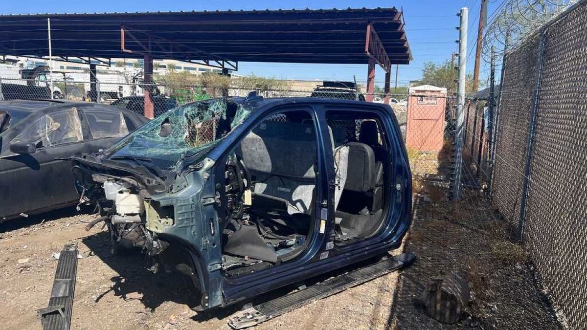 Stripped-down stolen truck in junkyard