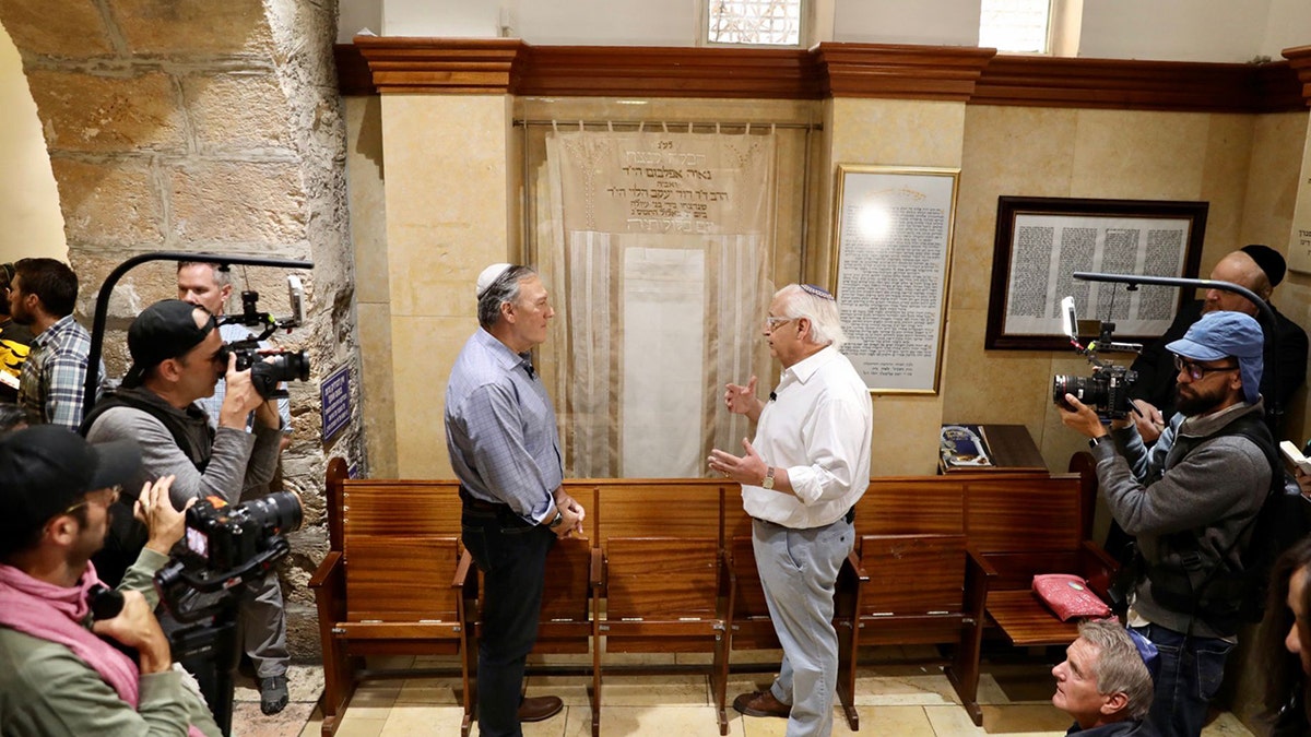 Former Sec. of State Mike Pompeo and David Friedman inside Rachel's tomb surrounded by others