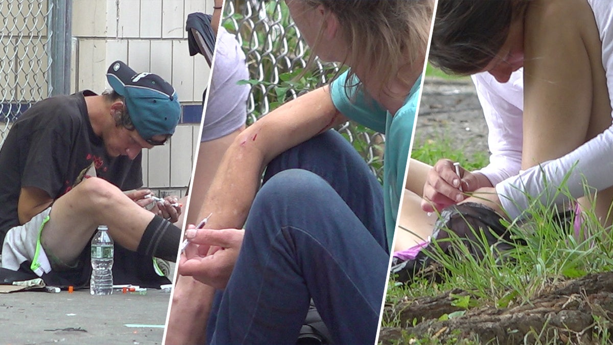Drug users injecting themselves with needles in Kensington
