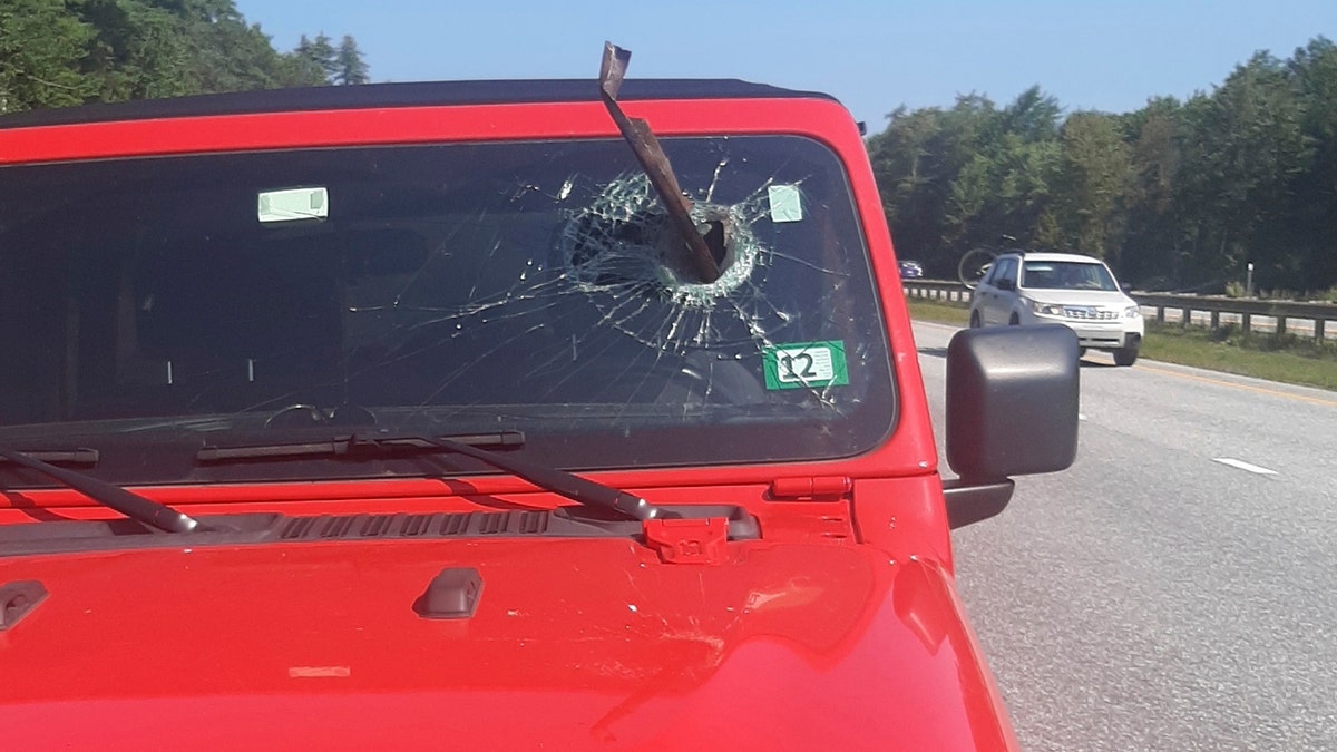 Windshield penetrated by suspected truck part
