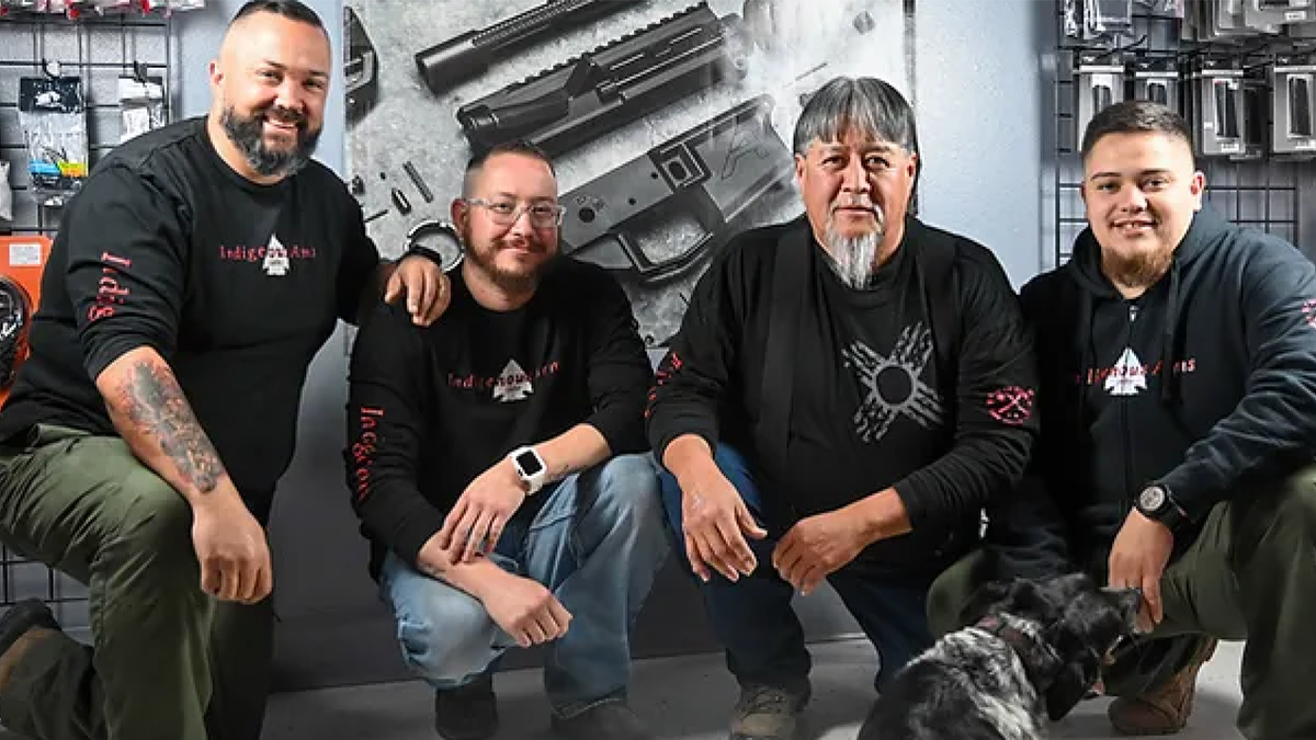 staff of Indigenous Arms gun shop with owner at far left