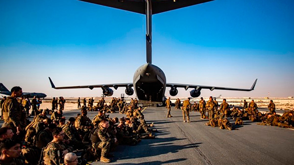 Marines awaiting a flight in Afghanistan
