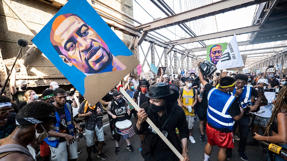 George Floyd sign held by protester on Brooklyn Bridge