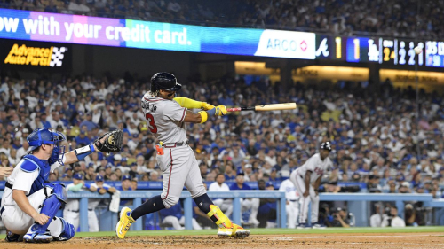 Atlanta Braves' Ronald Acuna Jr., right, hits a grand slam as Los Angeles Dodgers catcher Will Smith watches during the second inning of a baseball game Thursday, Aug. 31, 2023, in Los Angeles. (AP Photo/Mark J. Terrill)