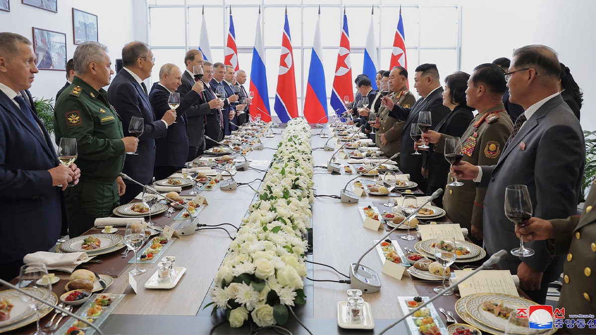 Putin, Kim raise glasses toward each other