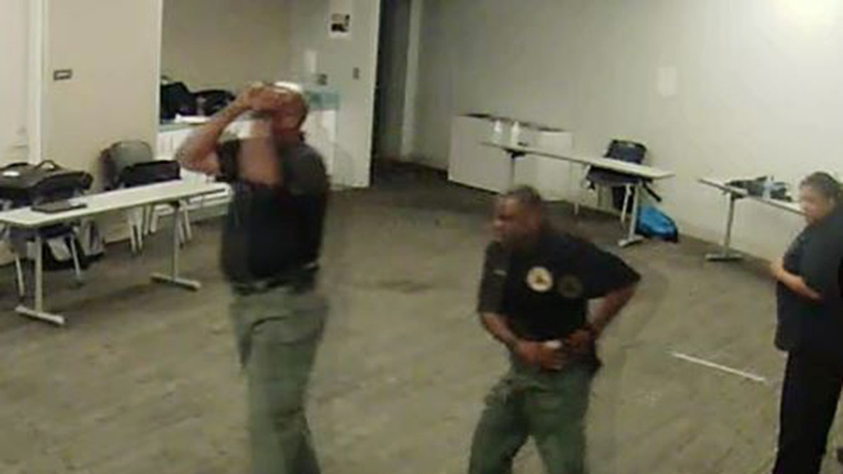 Surveillance video shows shooter's reaction