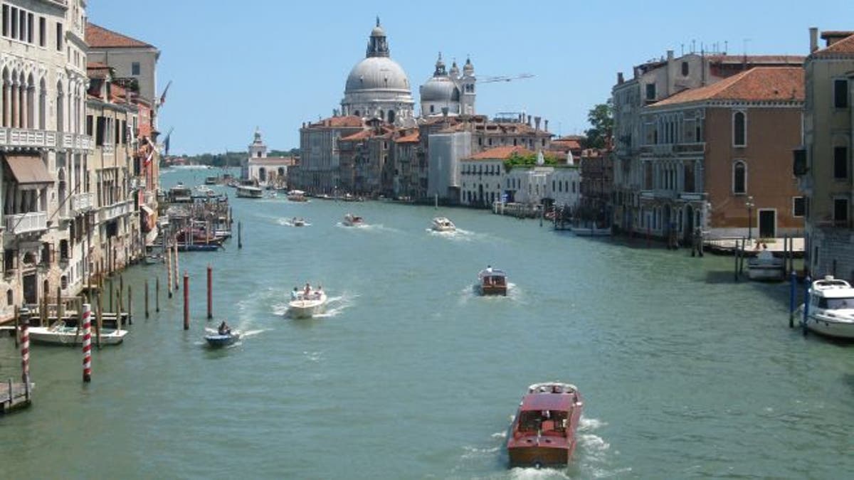 July 17, 2012: Water traffic bustling on the Grande Canale in the heart of Venice, Italy. 