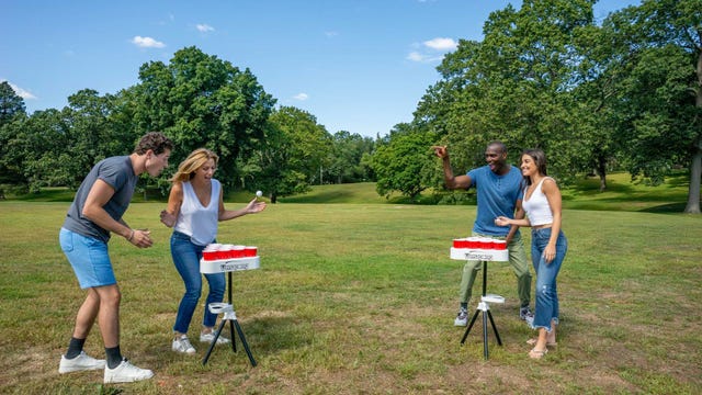 friends playing beer pong