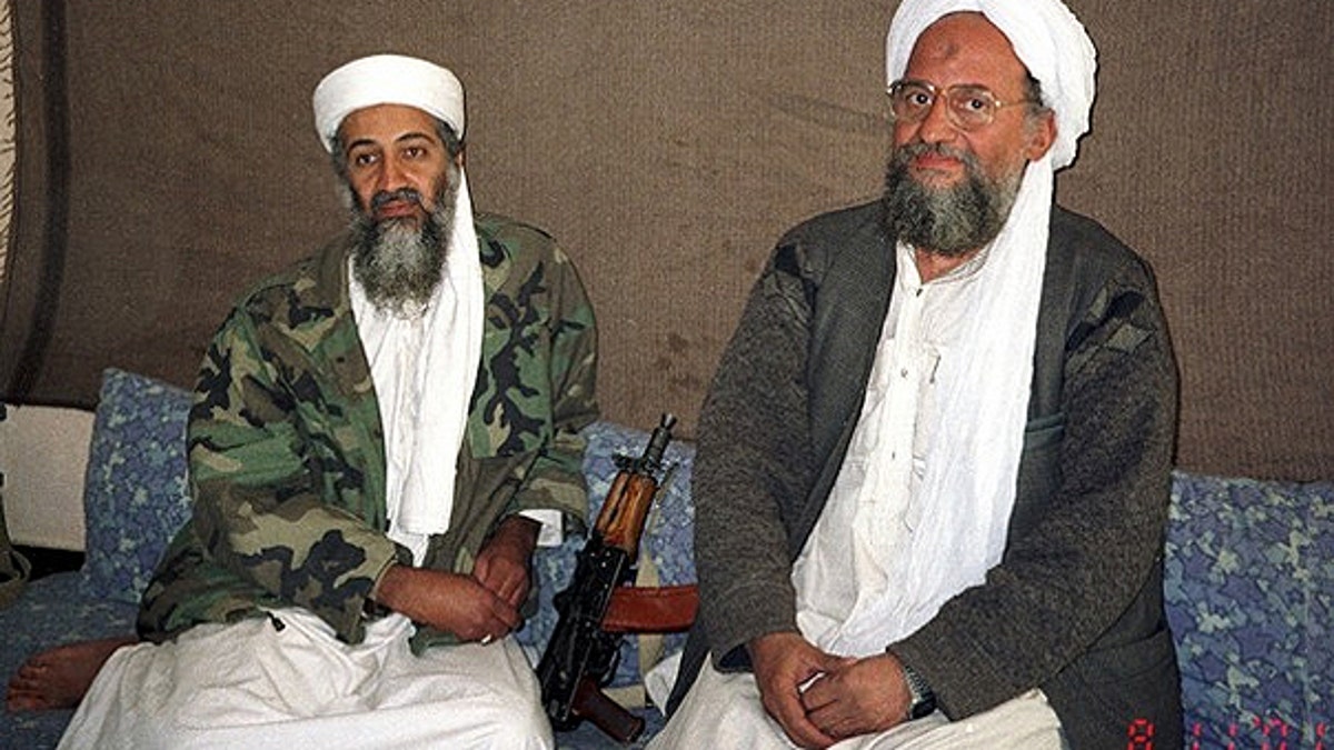 Nov. 10, 2001: Usama bin Laden sits with his adviser and purported successor Ayman al-Zawahiri, an Egyptian linked to the Al Qaeda network, during an interview with Pakistani journalist Hamid Mir (not pictured) in an image supplied by the respected Dawn newspaper.