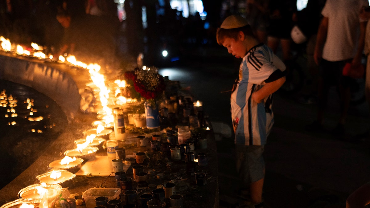 Israeli boy, candles, vigil