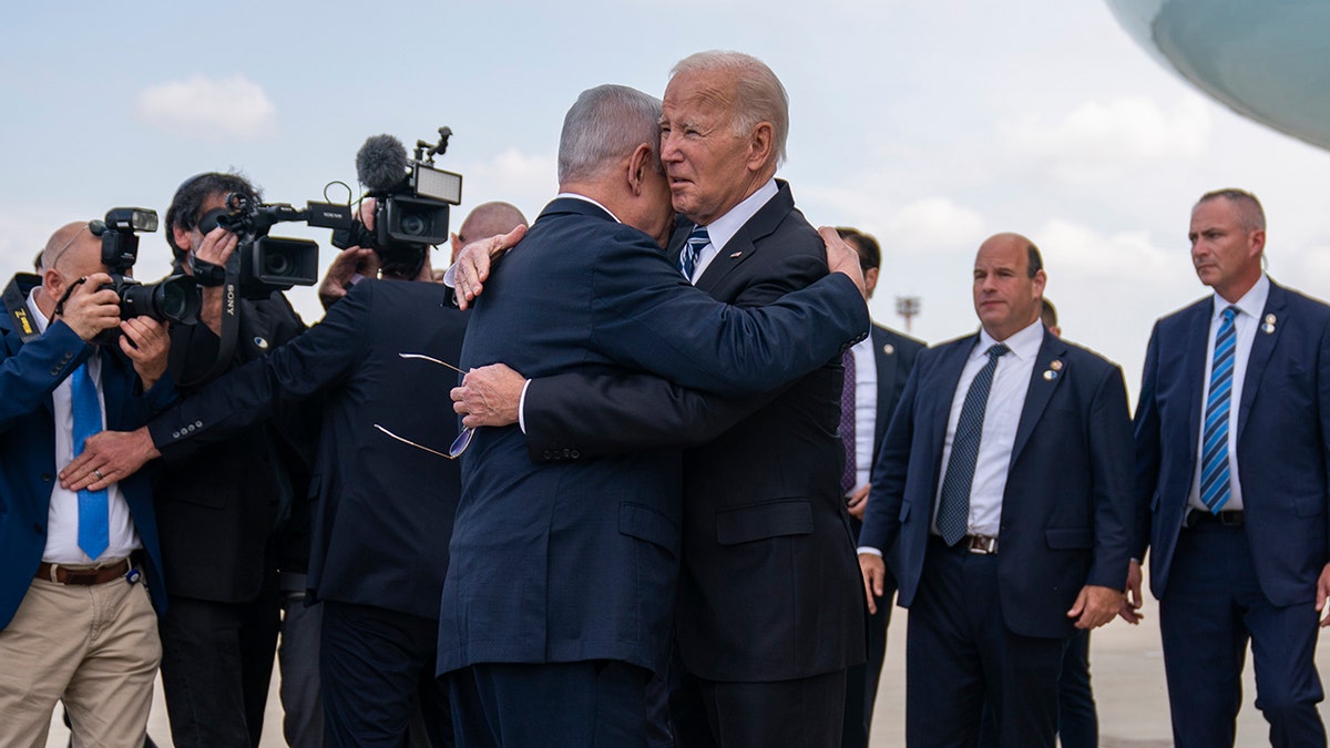 Biden hugging Netanyahu