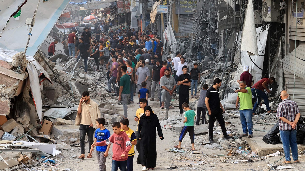 Palestinians amid rubble of their cities