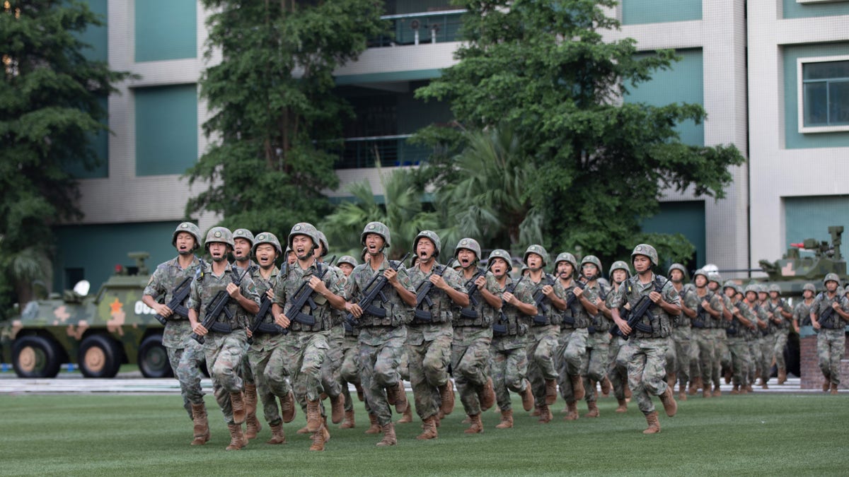 Nearly 100 People's Liberation Army soldiers in formation marching