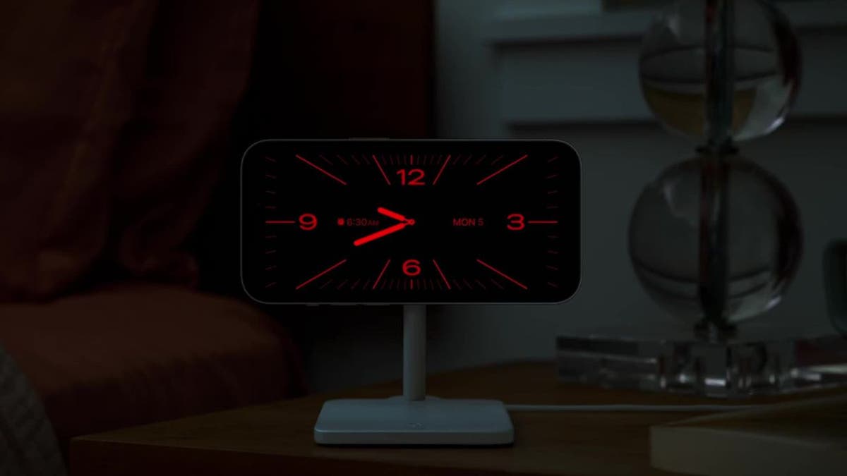 Red clock displayed on iPhone screen horizontally