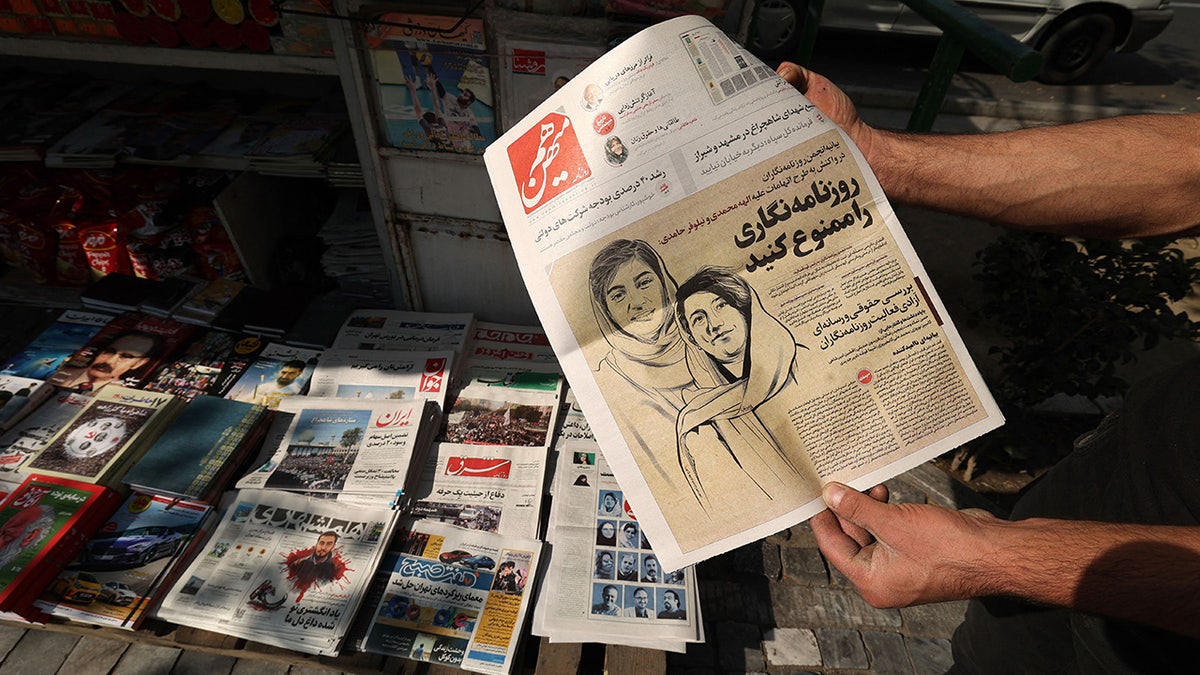 Detained Iranian journalists on cover of the newspaper