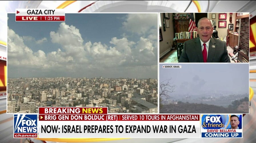 Iran threatens Israel as troops amass at Gaza border ahead of invasion