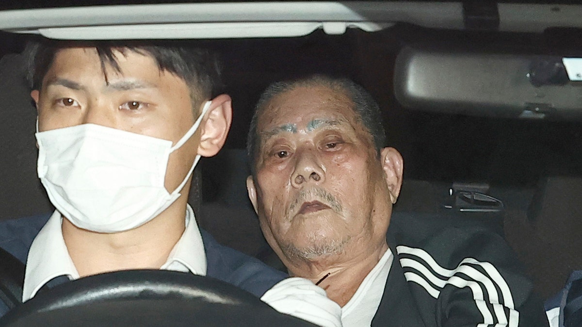 Hostage taker in Japan in back of a police car