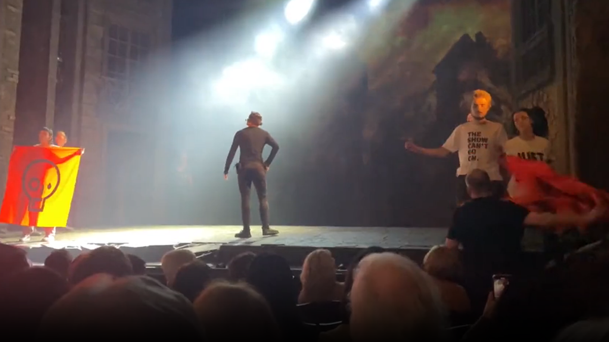 Les Miserables crowd in London boos as performance is interrupted by climate protesters