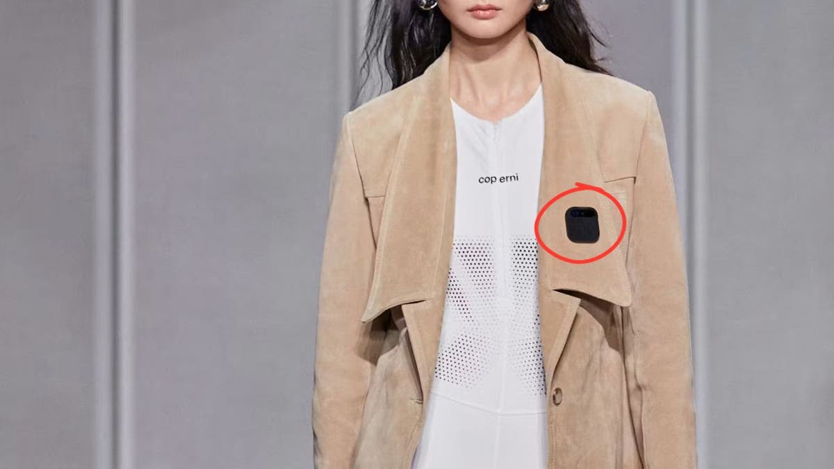 Woman wearing the AI Pin.