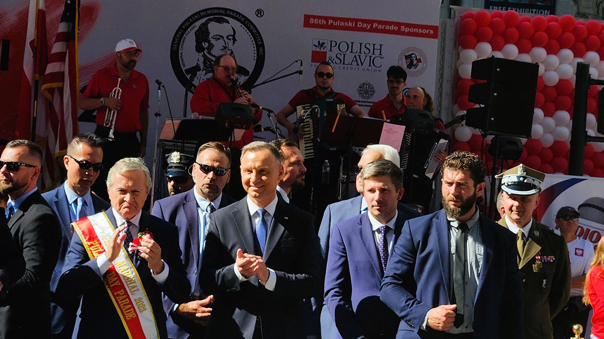 President Duda at a parade with Piotr Gilinski, Adrian Kubicki and others