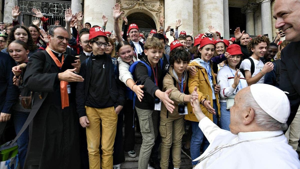 Pope Francis greeting youths