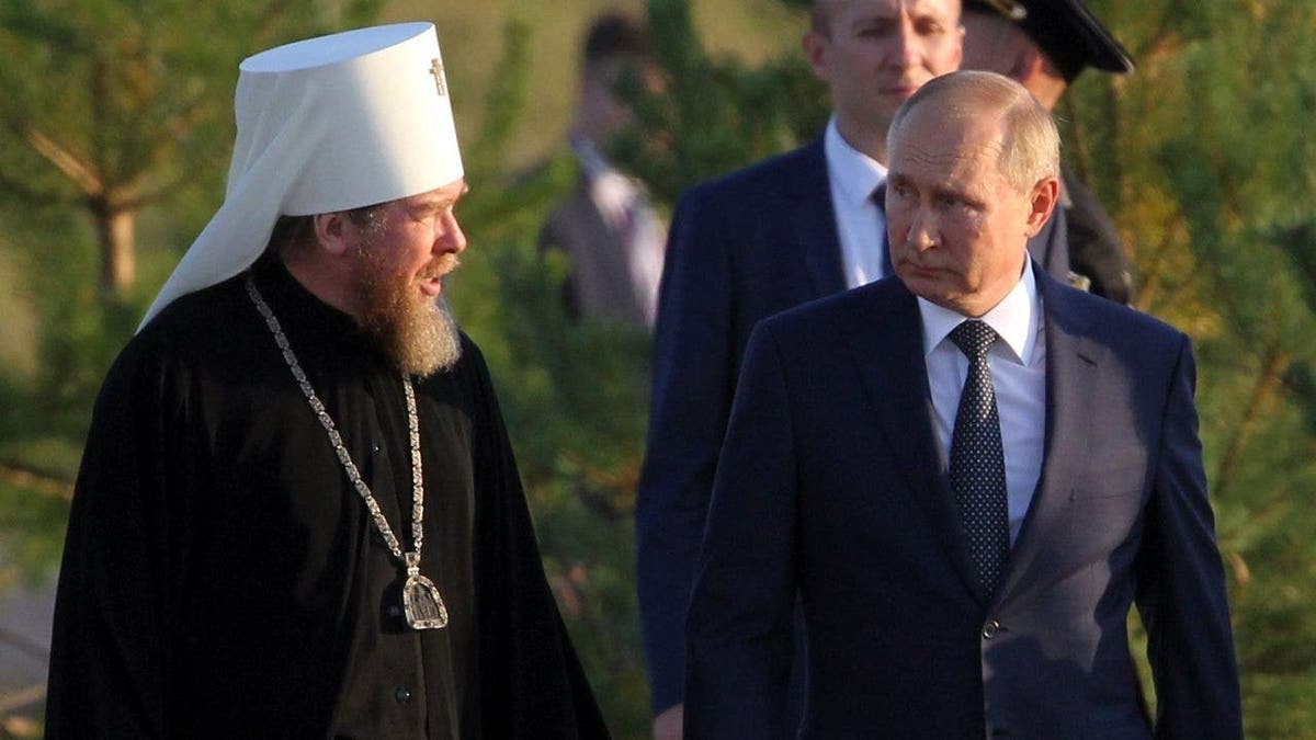 Tikhon and Putin walking and speaking