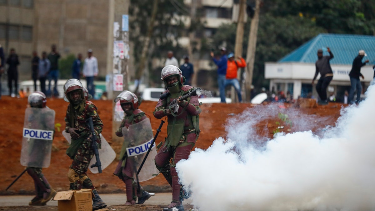 Riot police fire tear gas