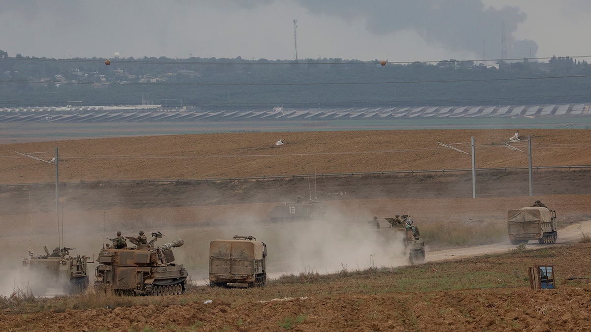 Israeli army vehicles on road in southern Israel