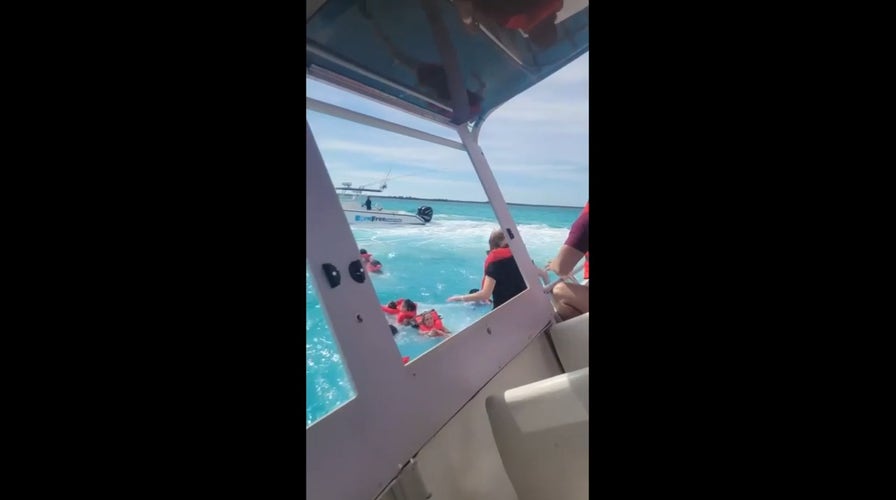 Bahamas tour boat passenger films vessel sinking, people jumping overboard