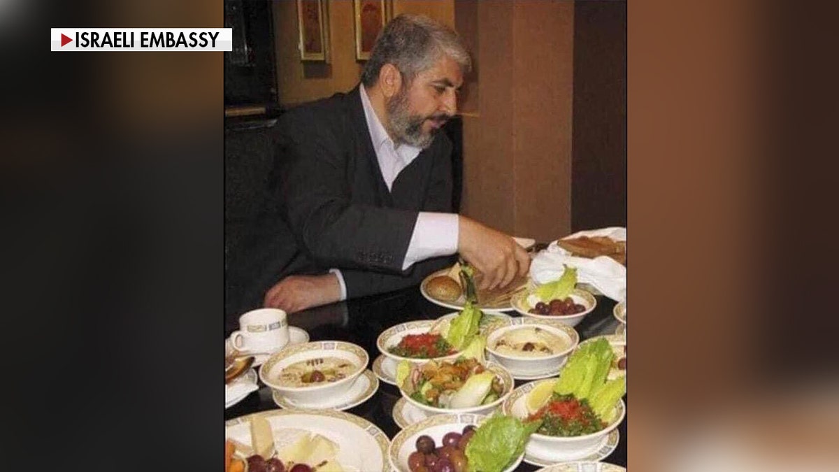 Hamas leader Khaled Mashal pictured eating.