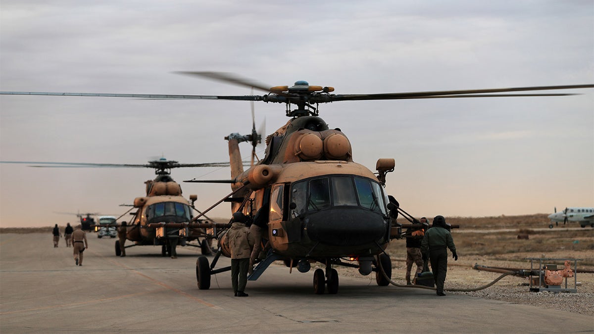 Iraqi Air Force helicopters land at Ain al-Asad airbase in Anbar province