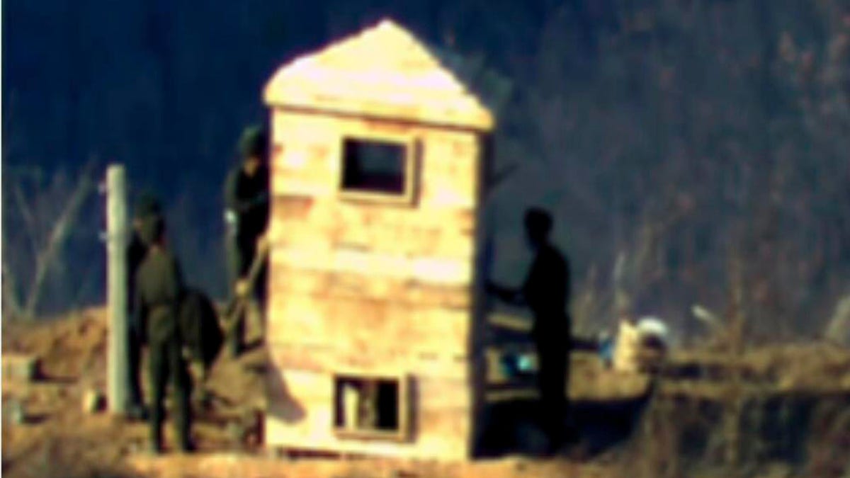 North Korean soldiers build border guard posts