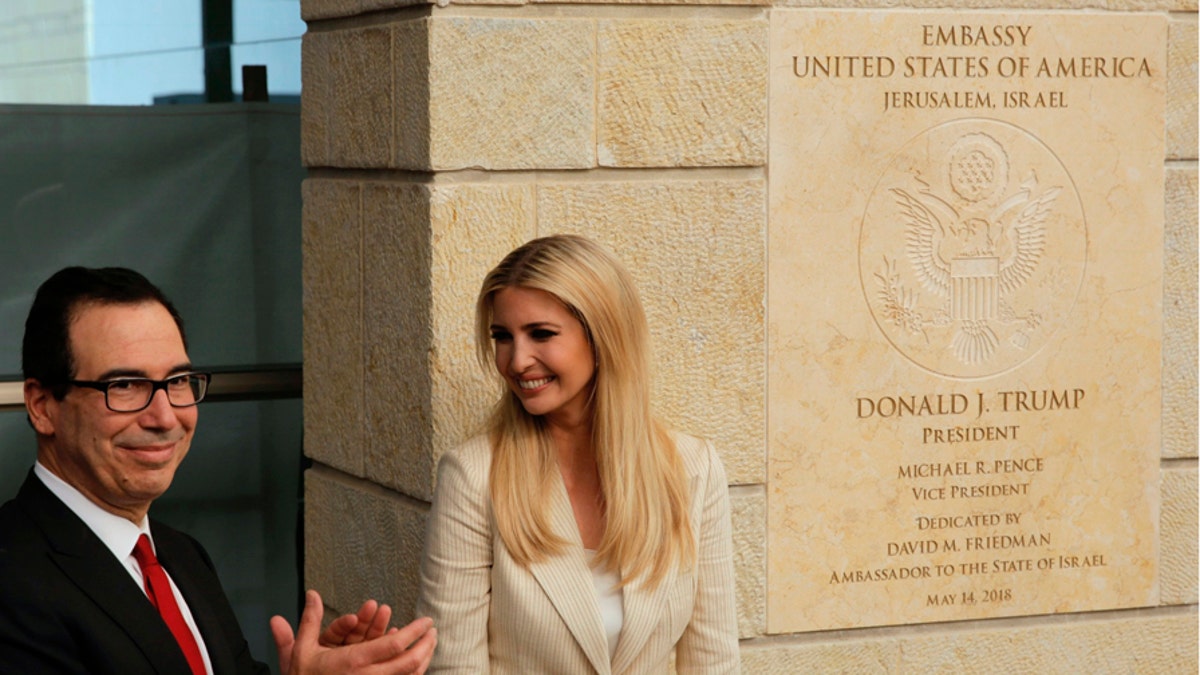 U.S. President Donald Trump's daughter Ivanka Trump, right, and U.S. Treasury Secretary Steve Mnuchin attend the opening ceremony of the new U.S. embassy in Jerusalem, Monday, May 14, 2018. Amid deadly clashes along the Israeli-Palestinian border, President Donald Trump's top aides and supporters on Monday celebrated the opening of the new U.S. Embassy in Jerusalem as a campaign promised fulfilled. (AP Photo/Sebastian Scheiner)