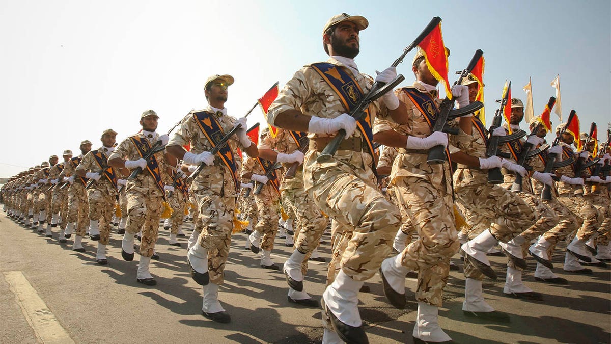 Iranian revolutionary guard members marching