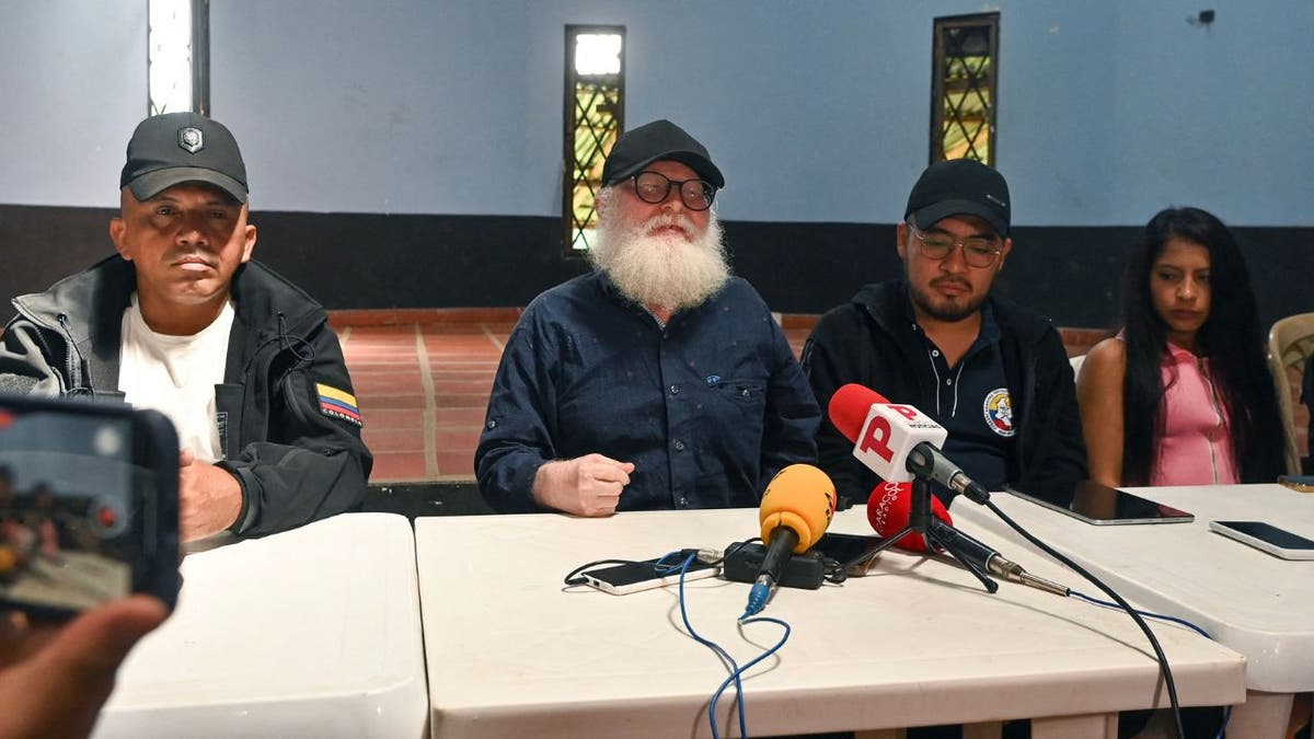Several members of the Colombian rebel group EMC hold a press conference