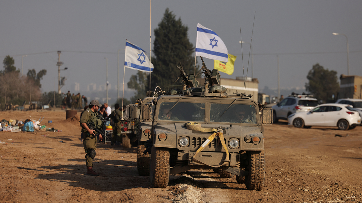 Israeli soldier and vehicles