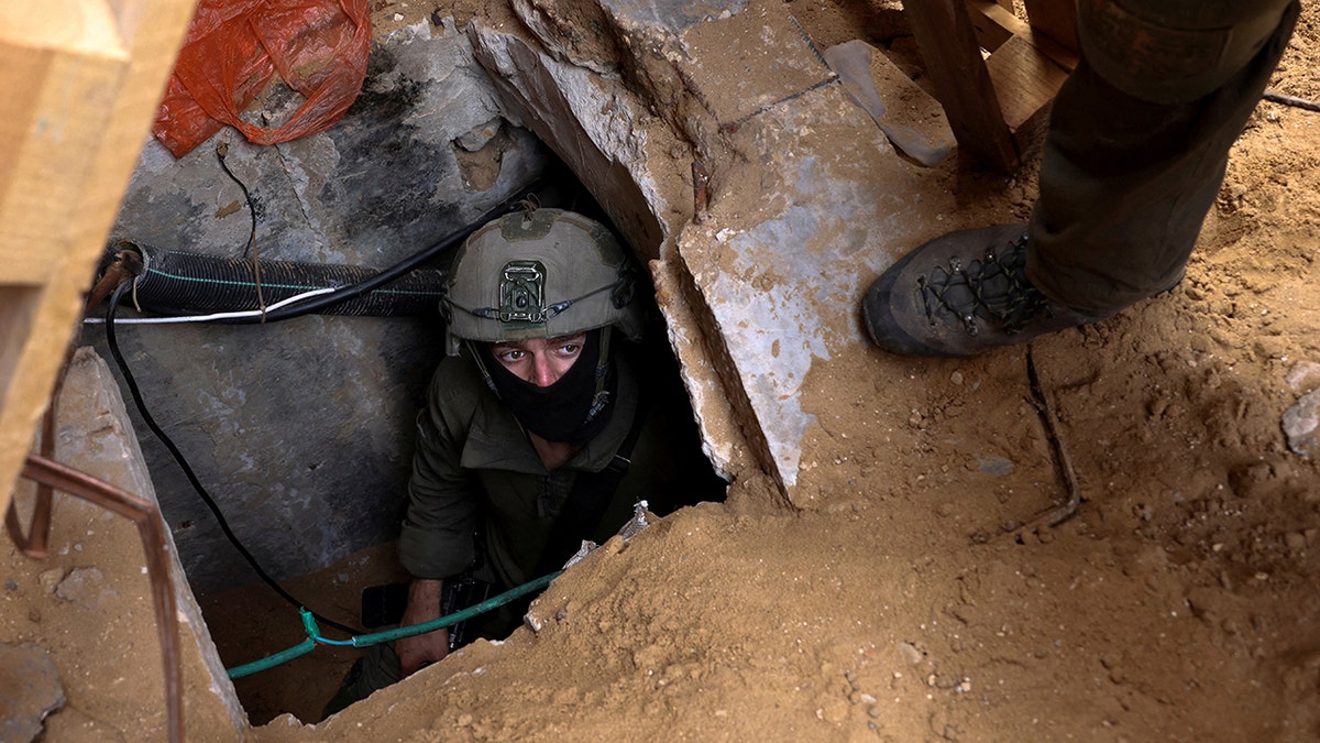An Israeli soldier investigates the entrance to a tunnel beneath Al-Shifa Hospital