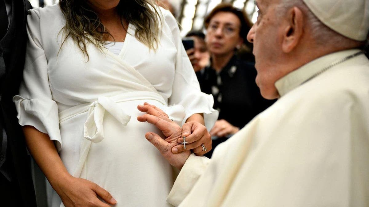 Pope blessing pregnant bride