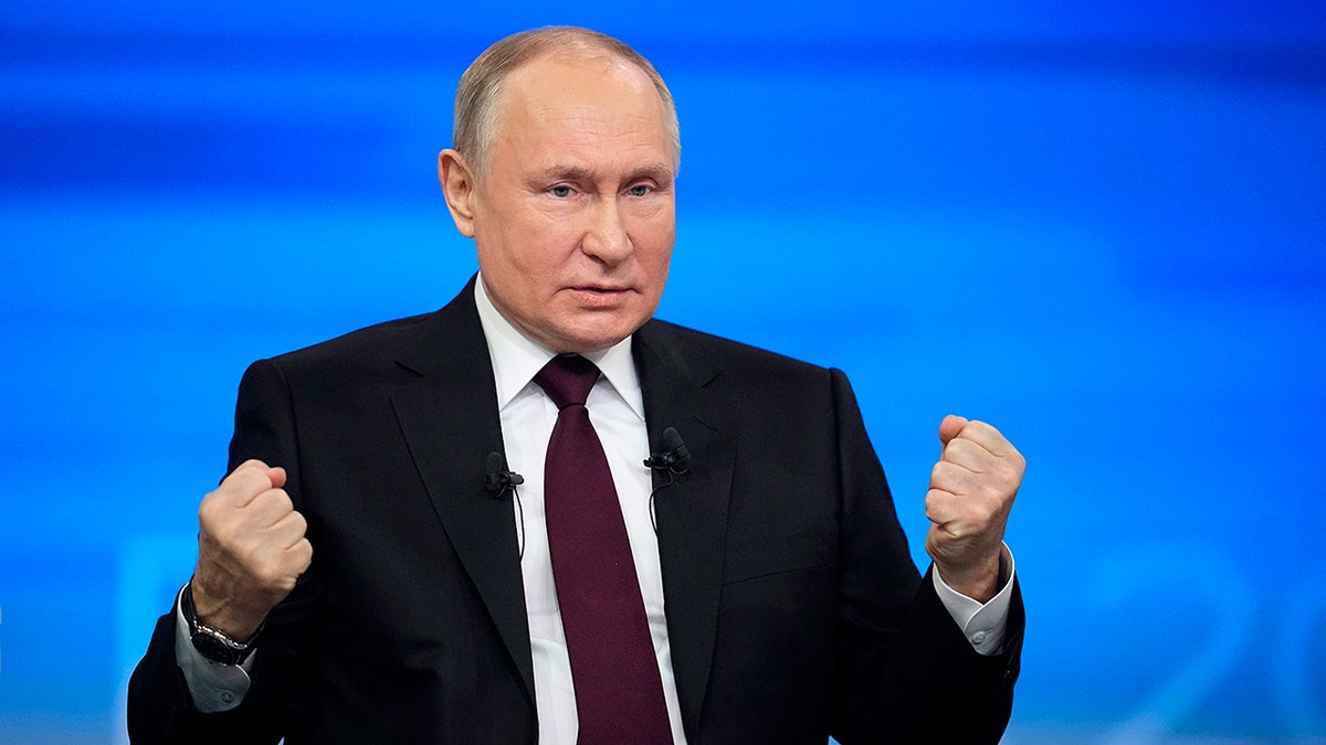 Putin with clinched fists