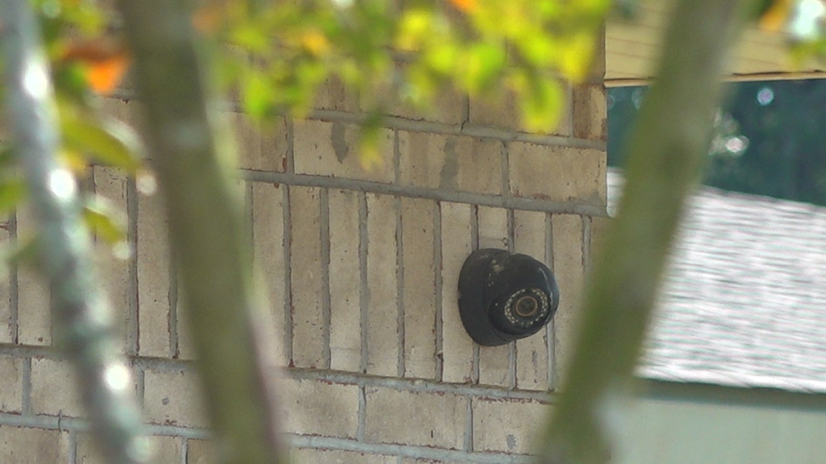 Camera attached to exterior wall