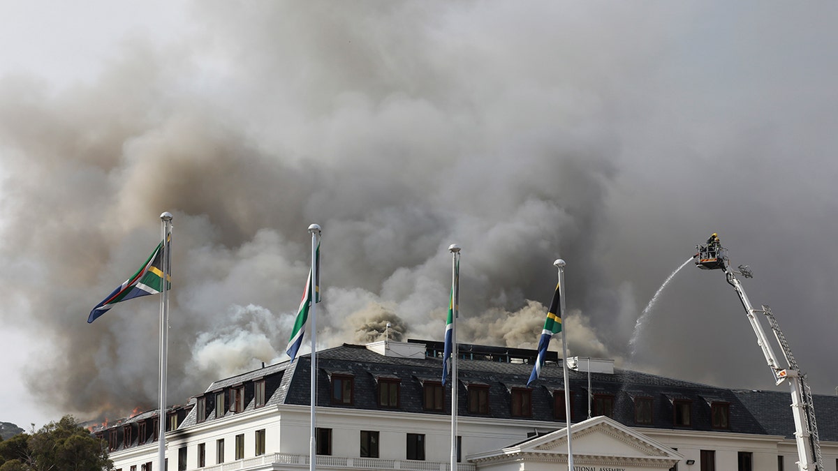 Smoke rises from the Parliament in Cape Town, South Africa