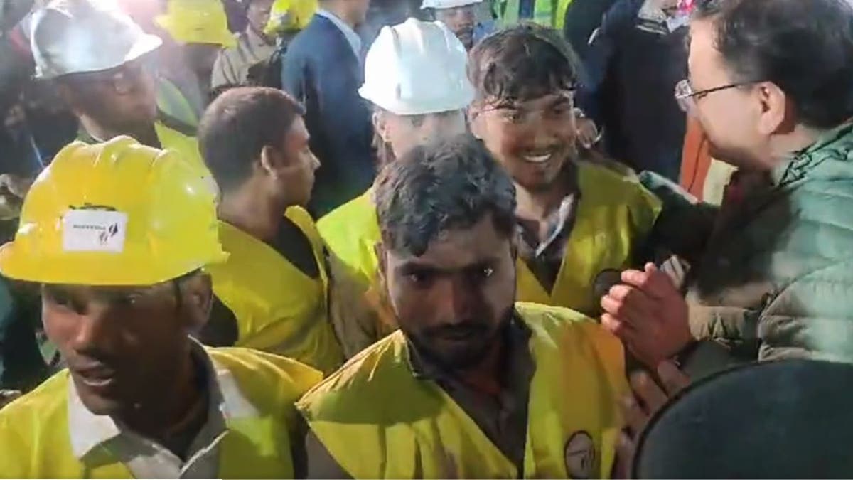 rescued Indian workers smiling