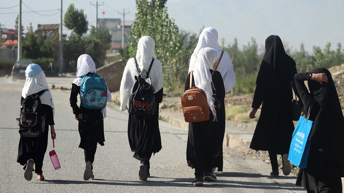 Afghanistan women with backpacks